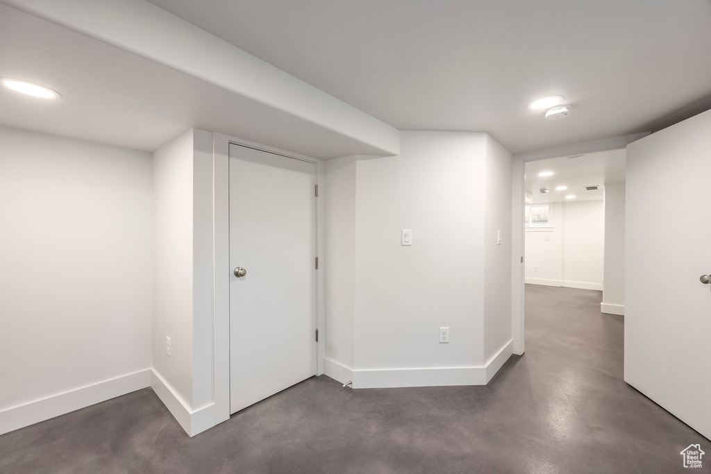 Basement with recessed lighting and baseboards