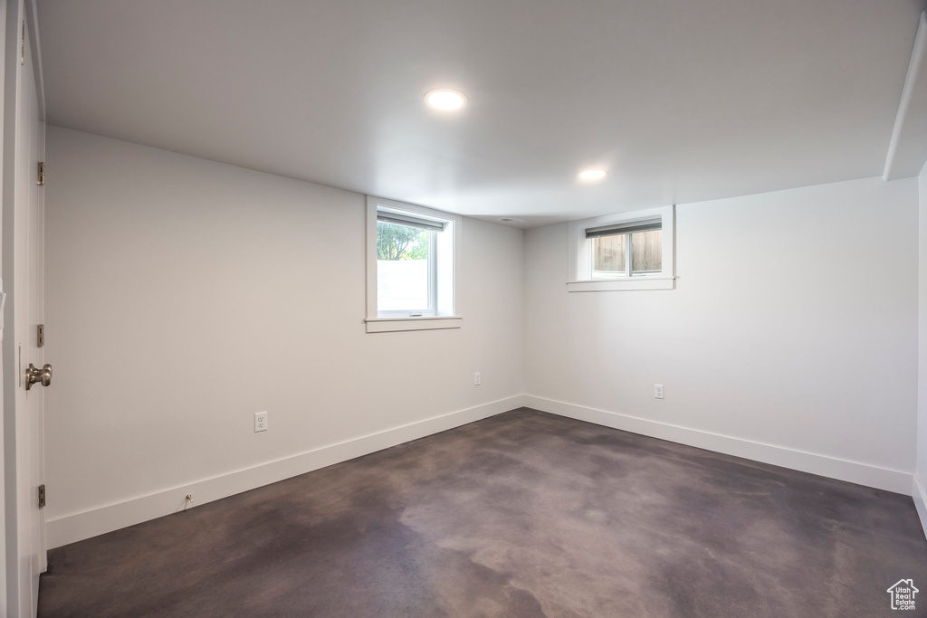 Basement with baseboards and recessed lighting
