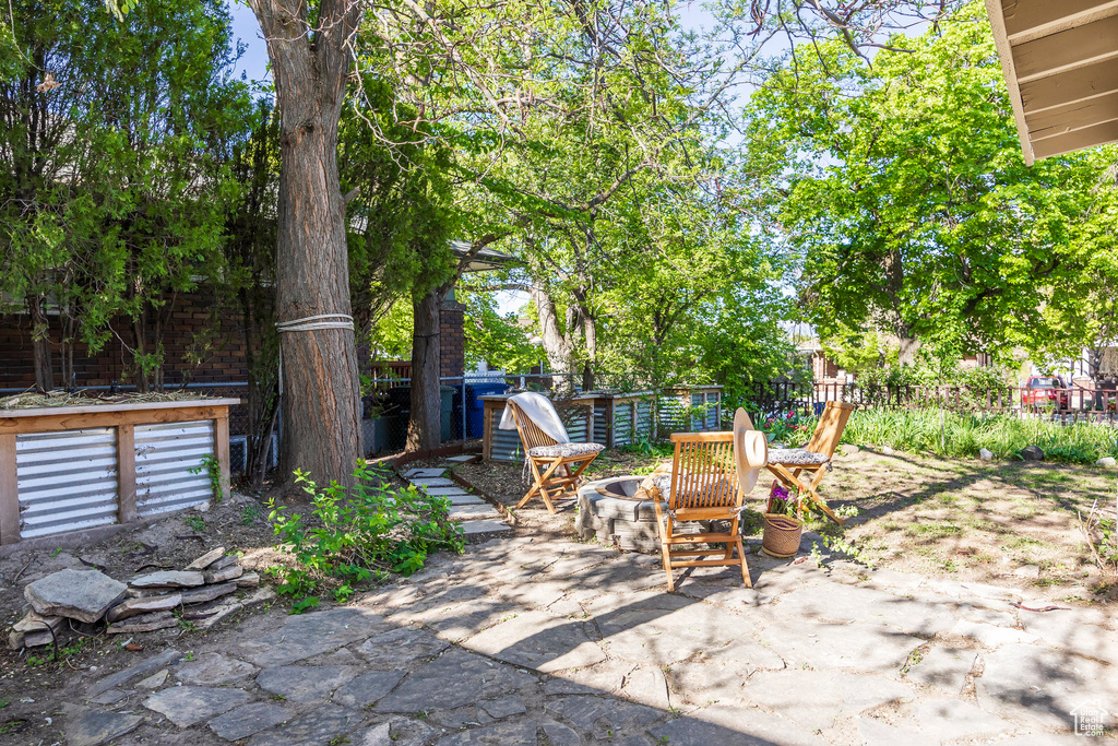View of patio featuring fence