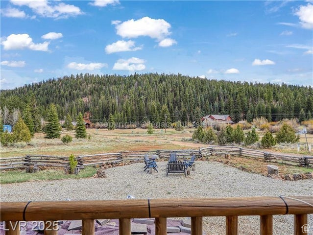 View of yard featuring a wooded view
