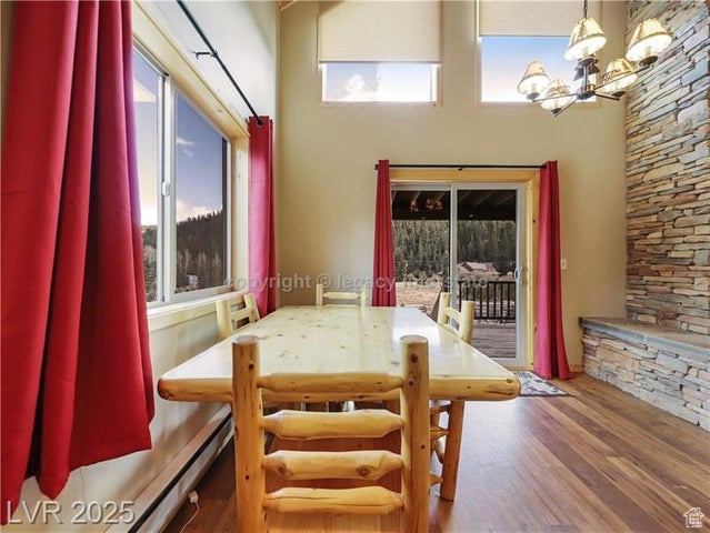 Dining room with a chandelier and wood finished floors