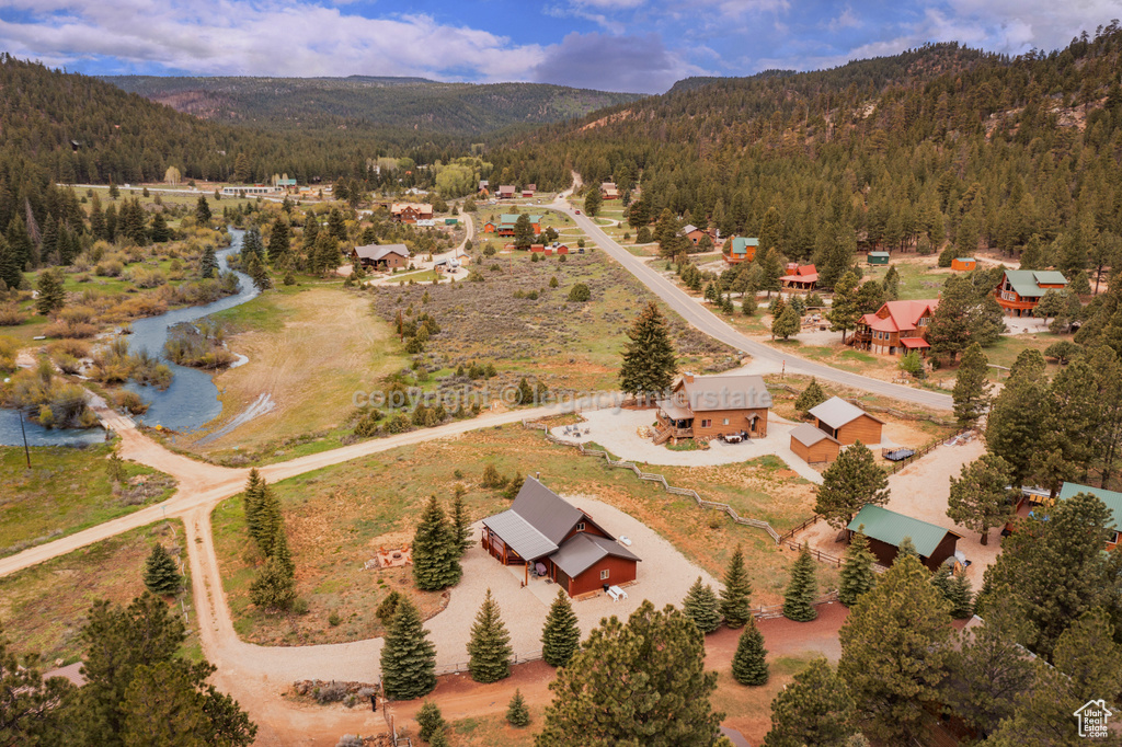 View of property location with a forest and a mountain backdrop