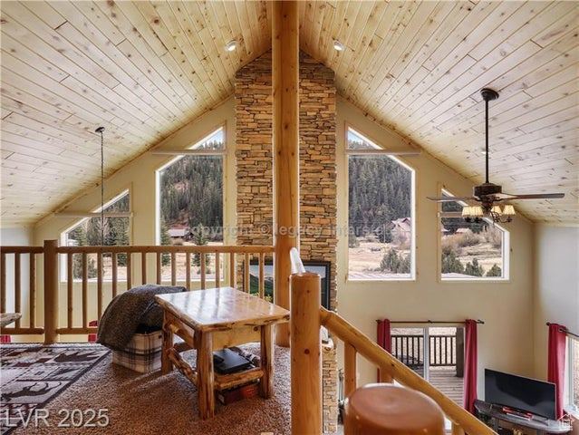 Bonus room with wood ceiling, ceiling fan, a wealth of natural light, and high vaulted ceiling