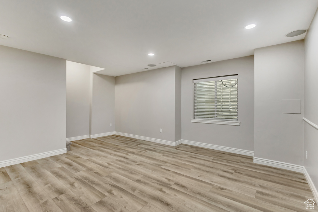 Basement featuring light wood-style floors, recessed lighting, and baseboards