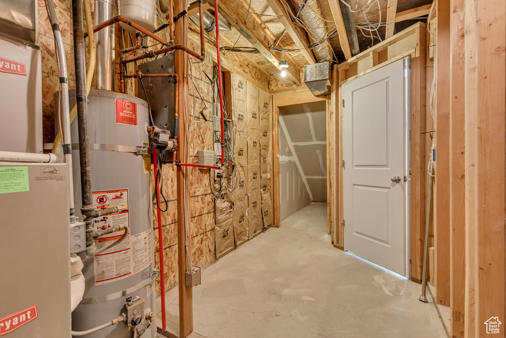 Utility room featuring water heater