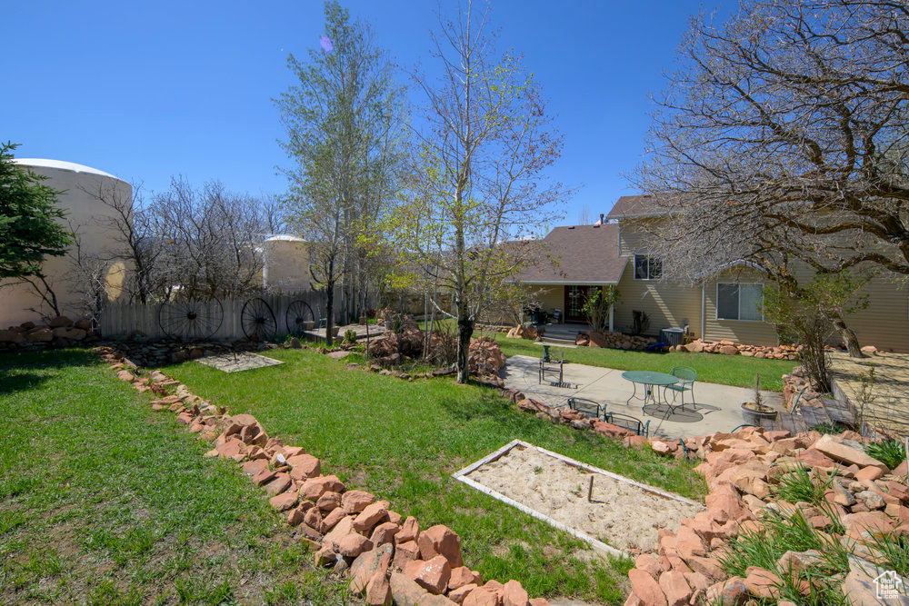 View of yard featuring a patio area and fence
