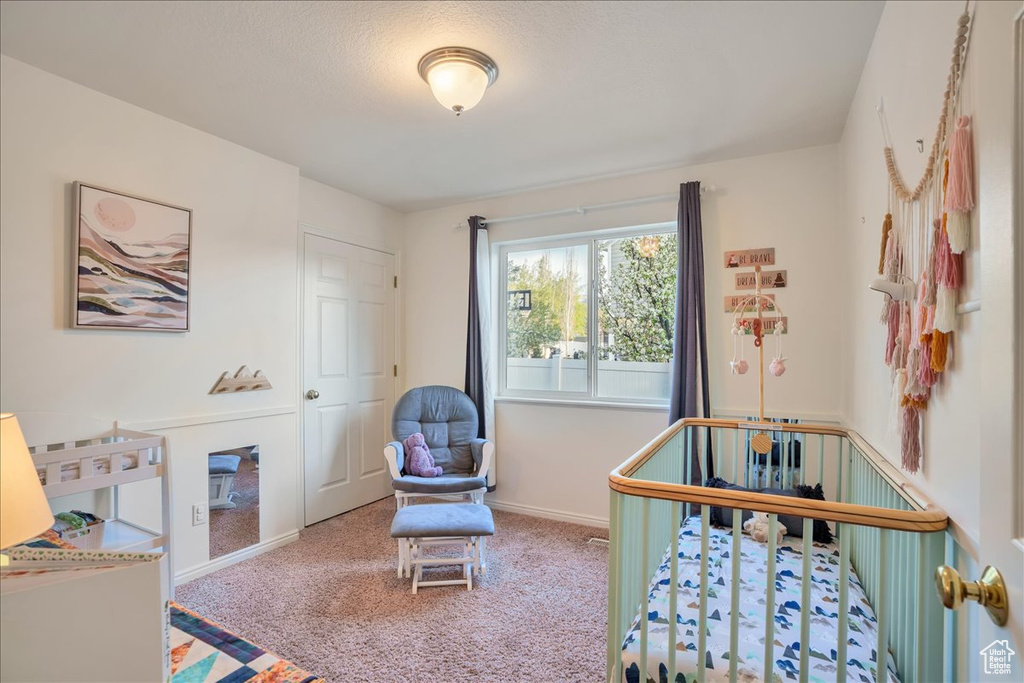 Carpeted bedroom with baseboards