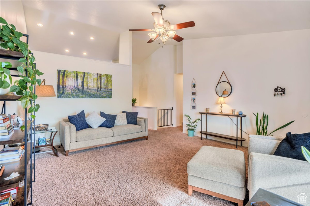 Carpeted living room featuring recessed lighting, a ceiling fan, and high vaulted ceiling