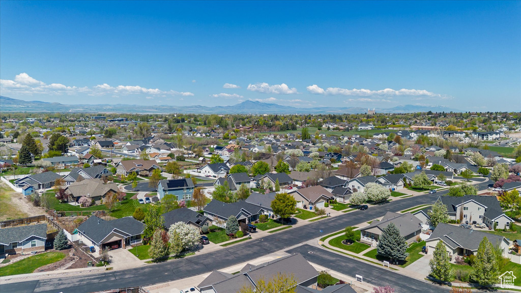 Drone / aerial view with a residential view and a mountain view
