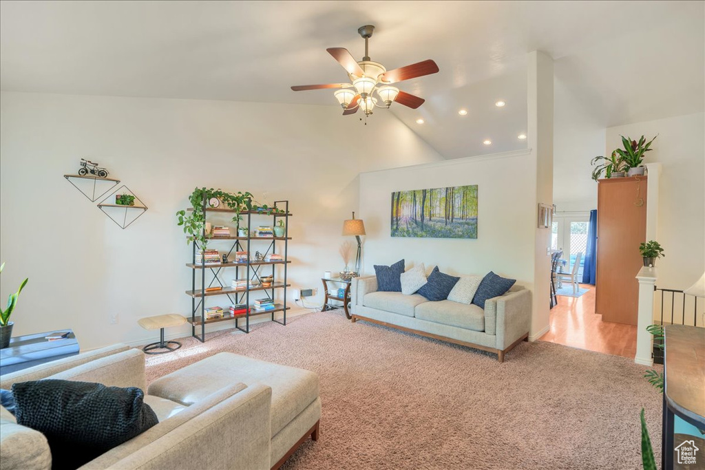Living area featuring carpet floors, recessed lighting, ceiling fan, and high vaulted ceiling