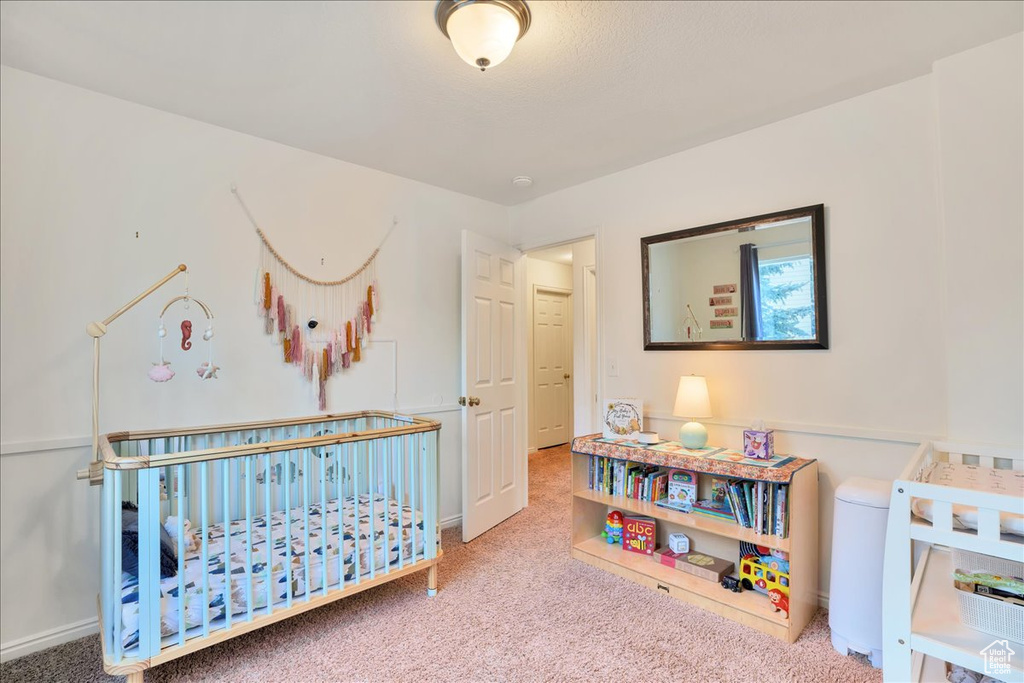 Bedroom with baseboards and carpet flooring