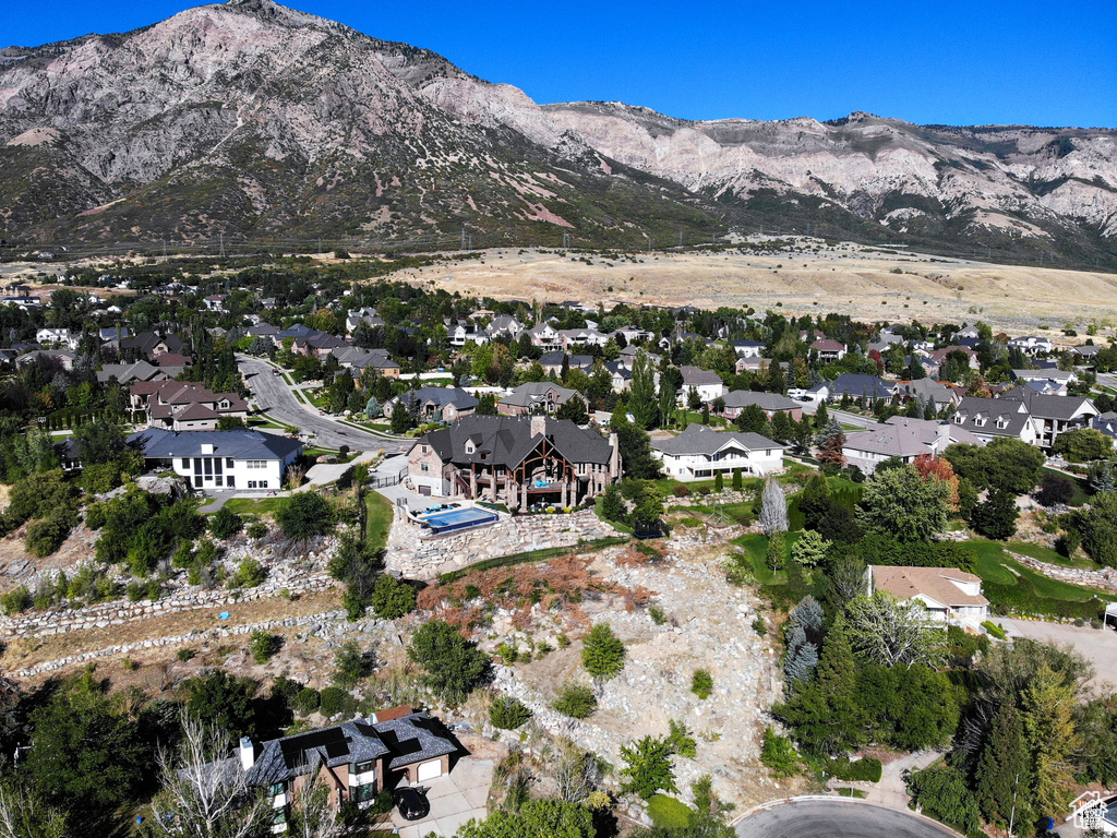 Drone / aerial view with a residential view and a mountain view
