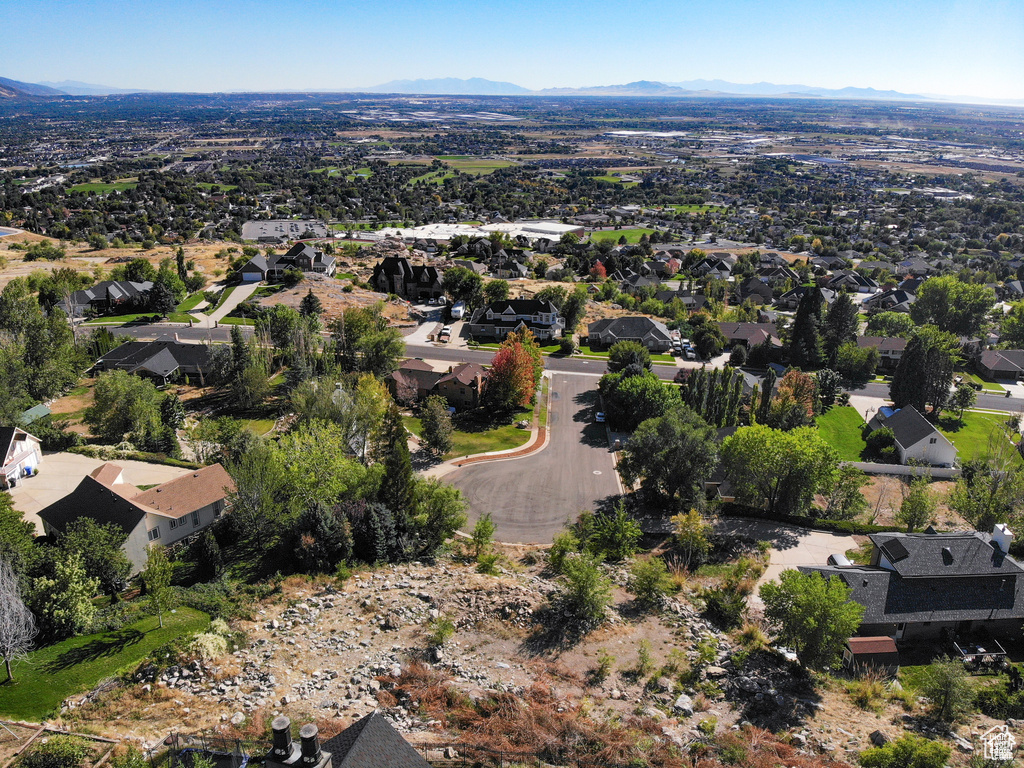 Birds eye view of property with a mountain view and a residential view