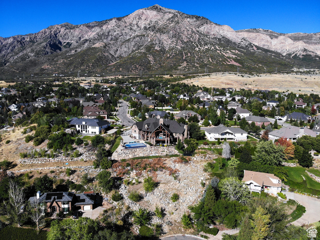Property view of mountains with a residential view