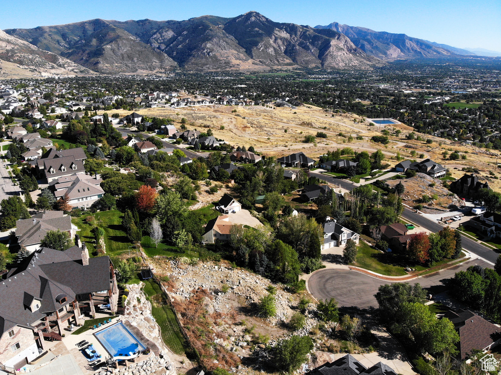 Birds eye view of property with a residential view and a mountain view