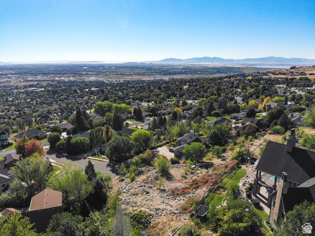 Birds eye view of property with a mountain view and a residential view