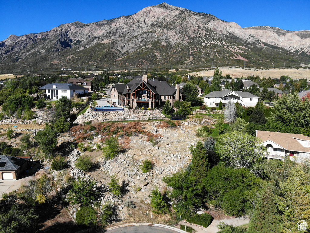 Property view of mountains with a residential view