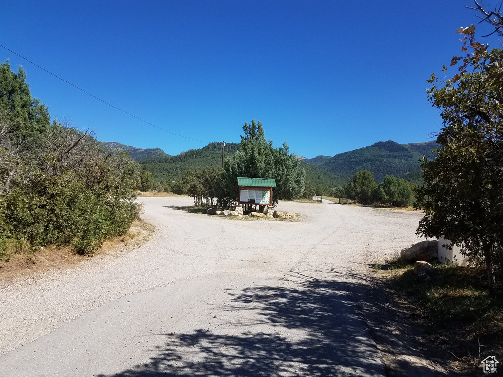 View of street with a rural view and a mountain view