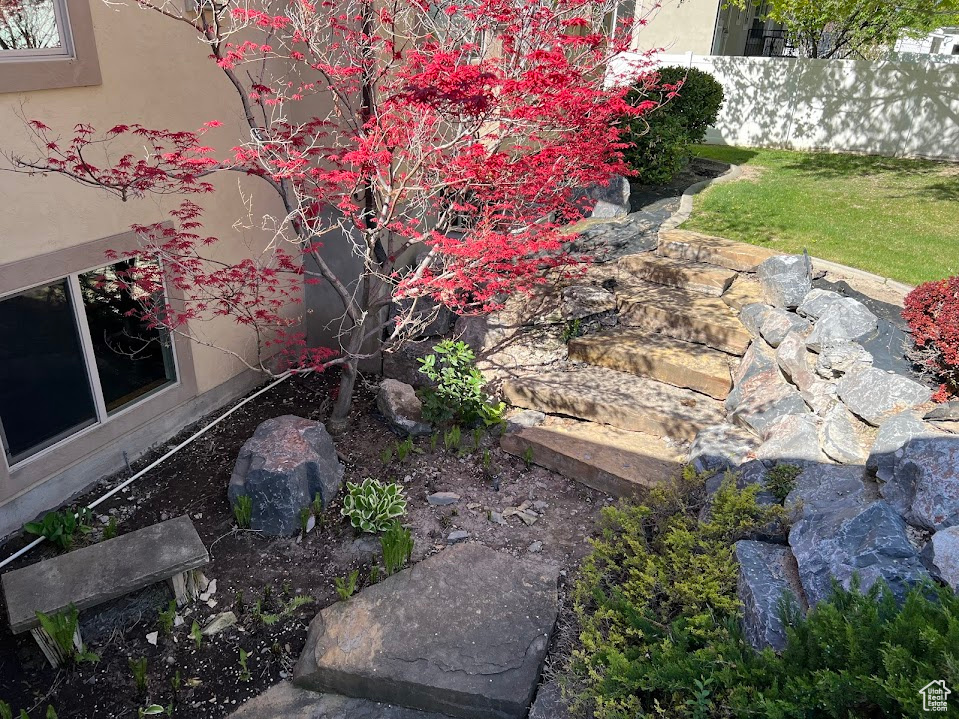 View of yard featuring fence