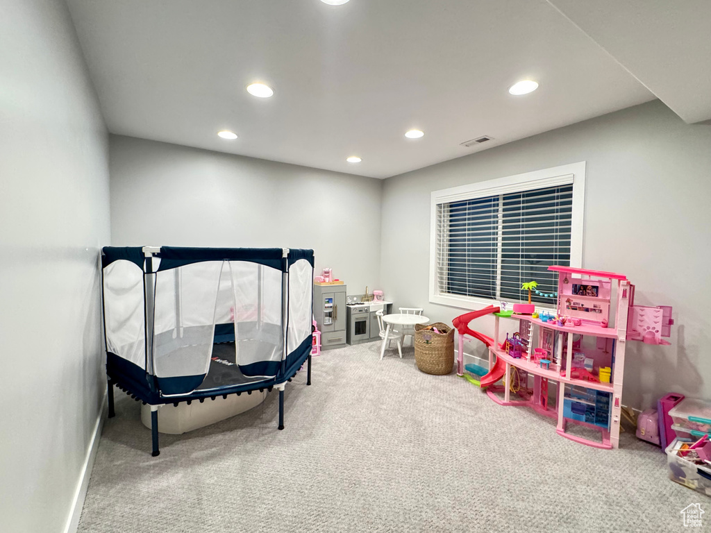Game room with recessed lighting, carpet flooring, and visible vents