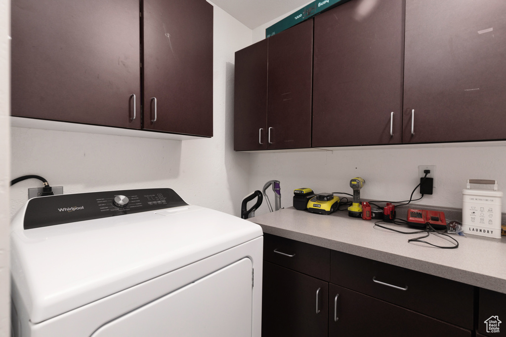 Washroom with washer / dryer and cabinet space