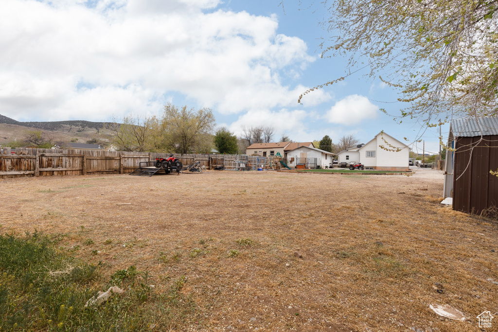 View of yard featuring fence