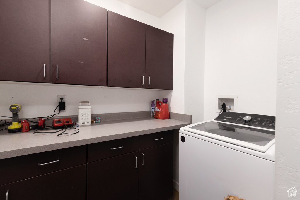 Washroom with washer / dryer and cabinet space