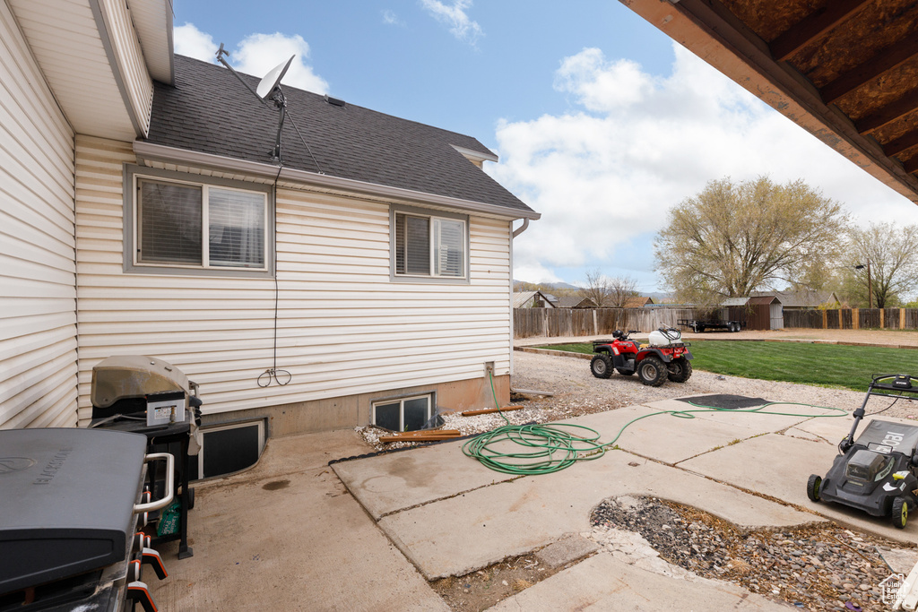View of patio with fence