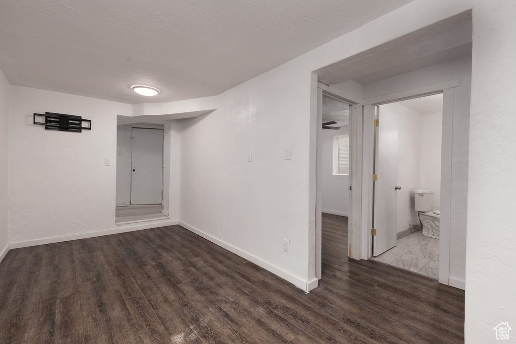 Unfurnished room featuring baseboards and wood finished floors
