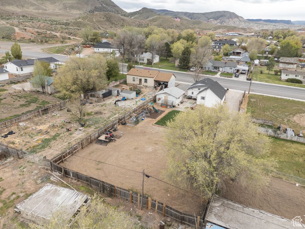 Birds eye view of property with a residential view and a mountain view