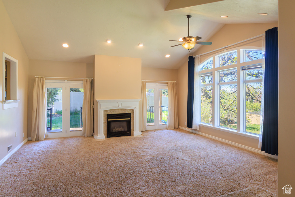 Unfurnished living room with ceiling fan, a fireplace, baseboards, carpet, and recessed lighting