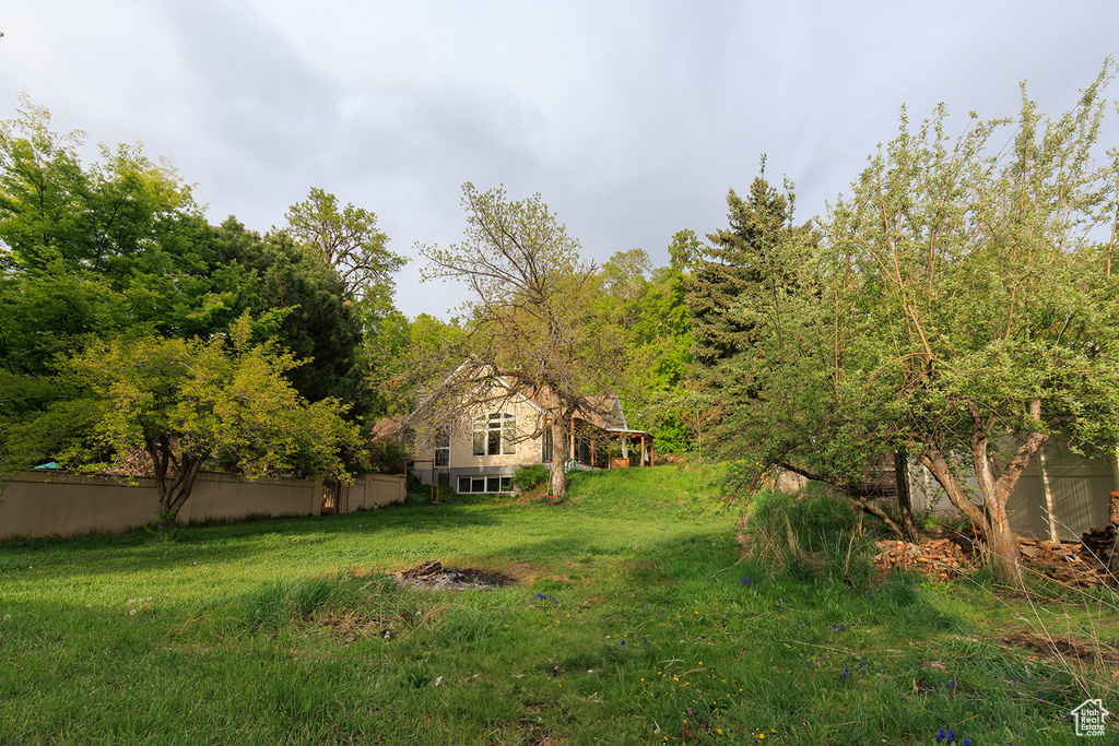 View of yard featuring fence