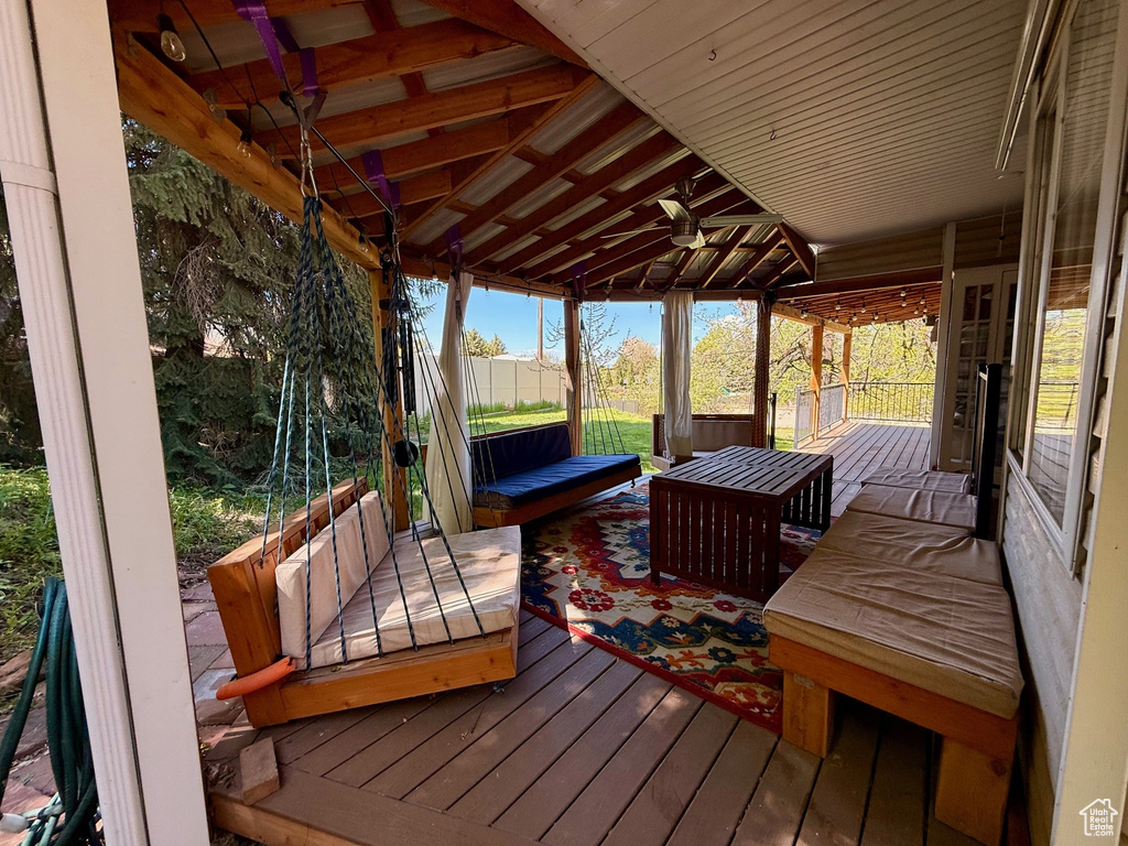 Wooden deck featuring ceiling fan