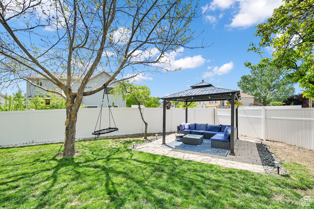 View of yard featuring a fenced backyard, a gazebo, an outdoor living space, and a patio area