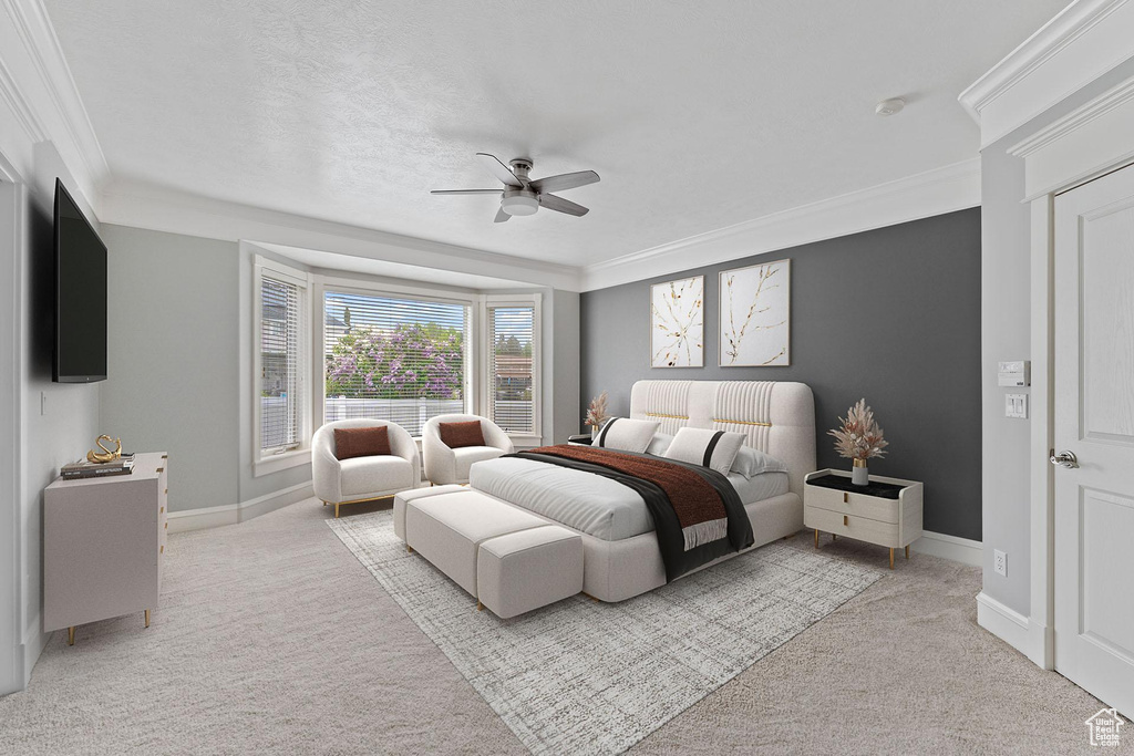Bedroom featuring light colored carpet, ornamental molding, baseboards, and ceiling fan