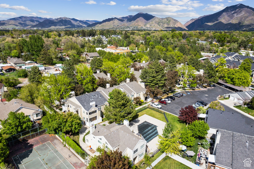 Birds eye view of property with a residential view and a mountain view