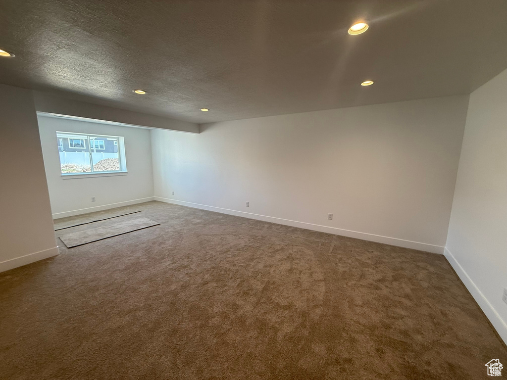 Empty room featuring baseboards, carpet flooring, and recessed lighting