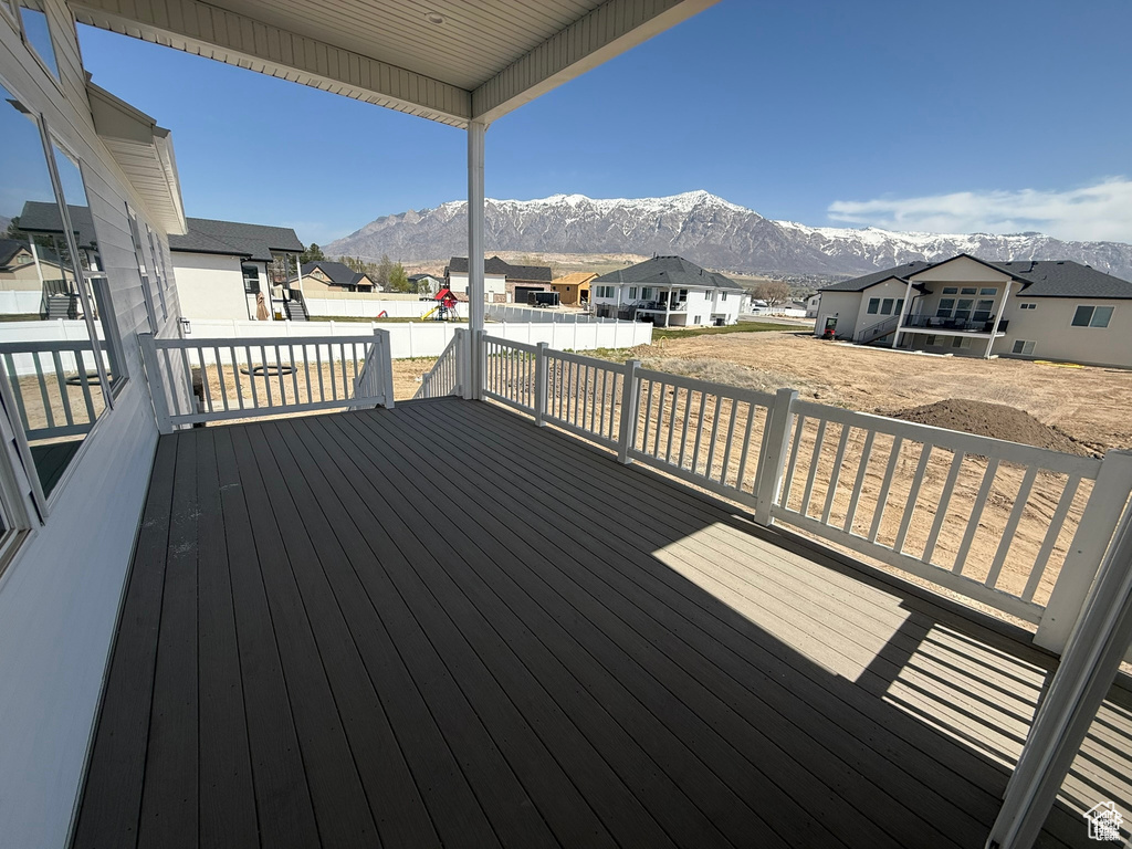 Wooden terrace with a mountain view and a residential view