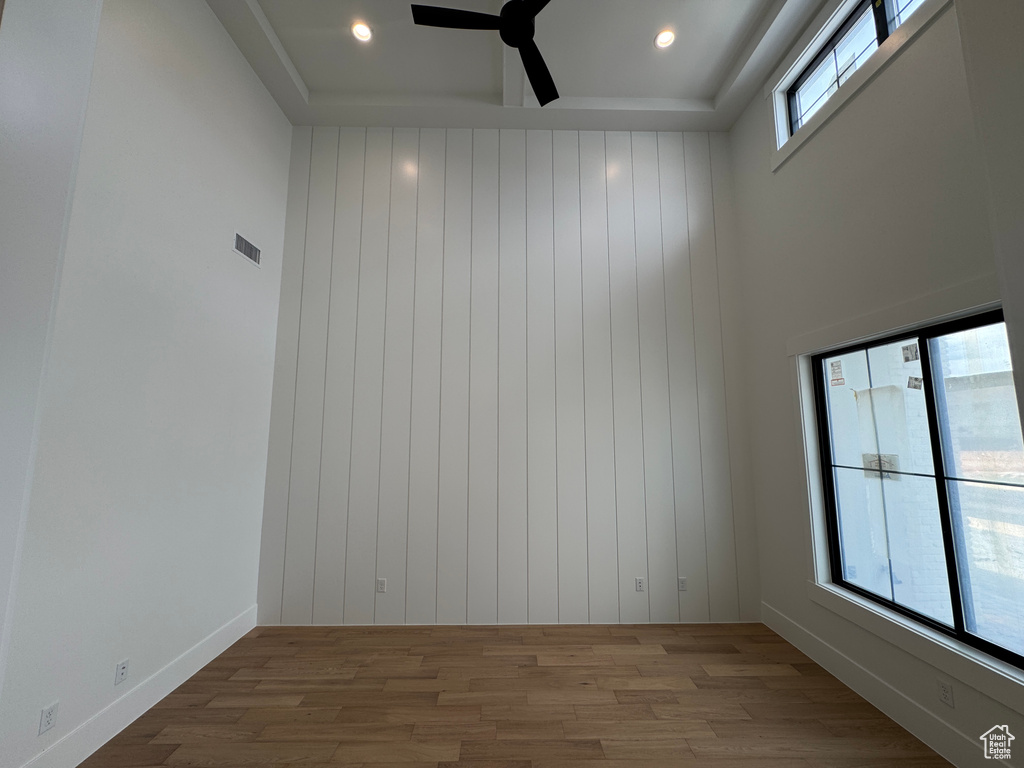 Unfurnished room featuring recessed lighting, ceiling fan, visible vents, and wood finished floors