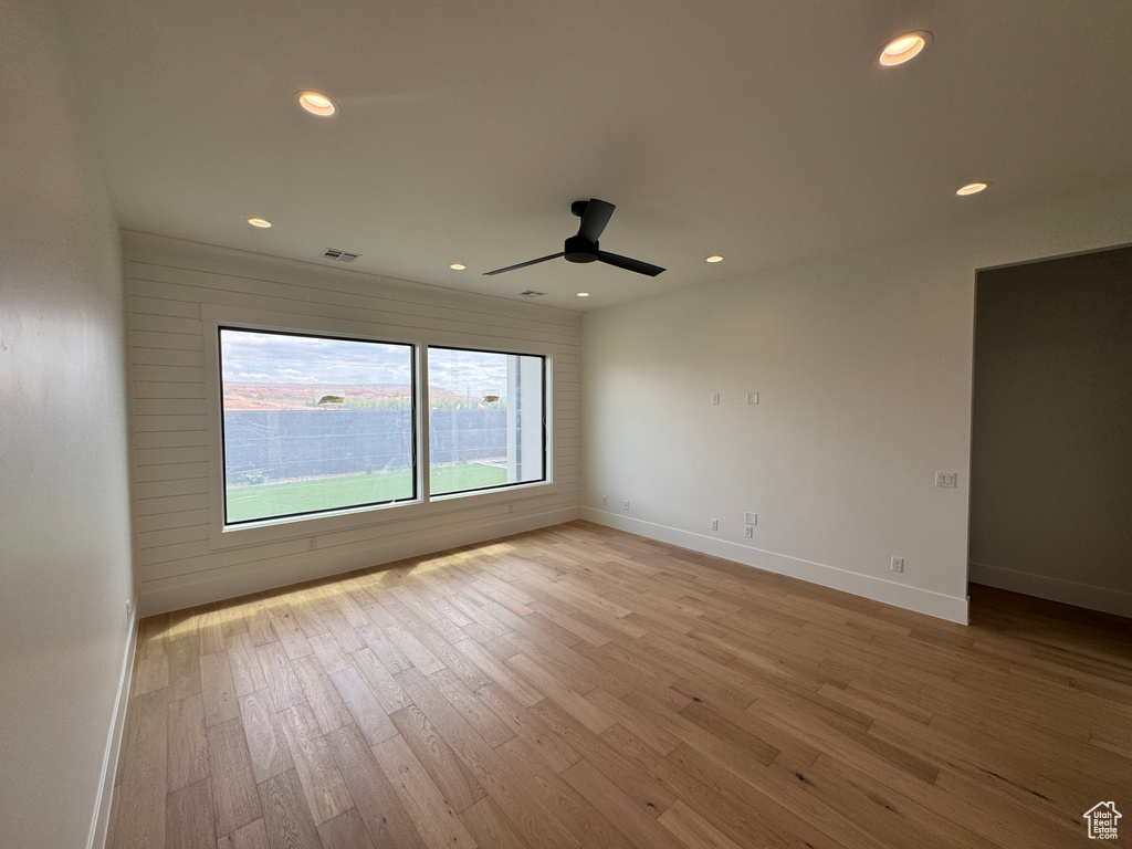 Unfurnished room featuring recessed lighting, visible vents, and light wood-style flooring