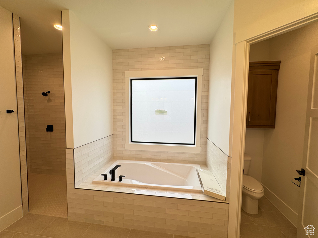 Full bathroom featuring toilet, tiled shower, recessed lighting, a bath, and tile patterned floors