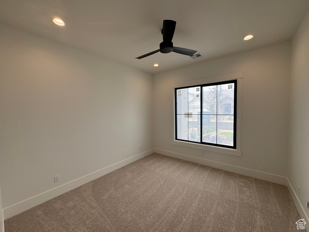 Unfurnished room featuring visible vents, light carpet, baseboards, recessed lighting, and a ceiling fan