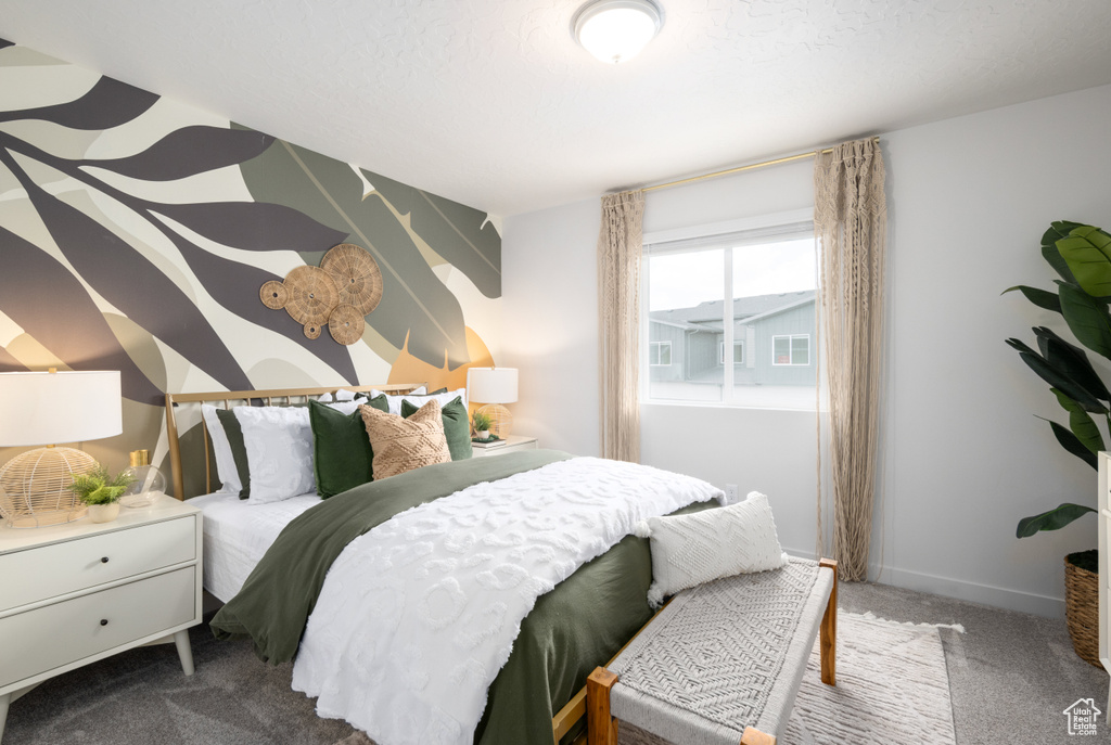 Carpeted bedroom with baseboards