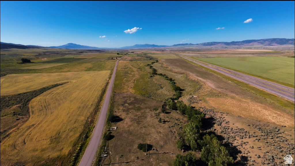 Birds eye view of property with a mountain view and a rural view