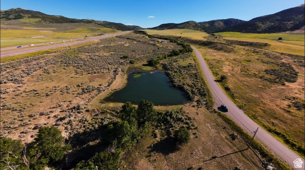 Birds eye view of property featuring a rural view and a water and mountain view