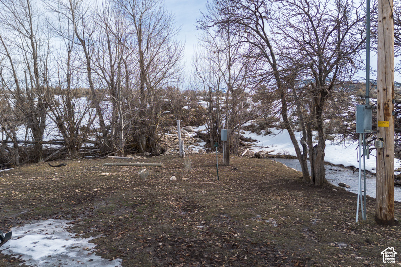View of yard covered in snow
