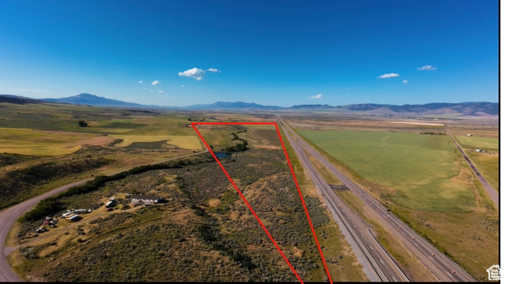 Drone / aerial view featuring a rural view and a mountain view