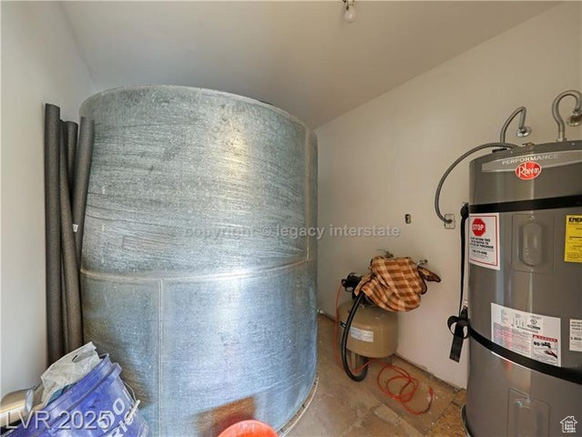 Utility room featuring water heater