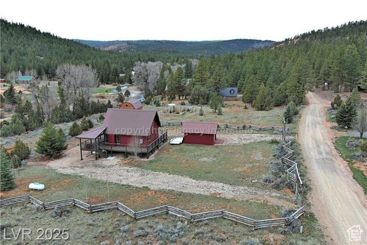 Bird\'s eye view with a mountain view and a wooded view