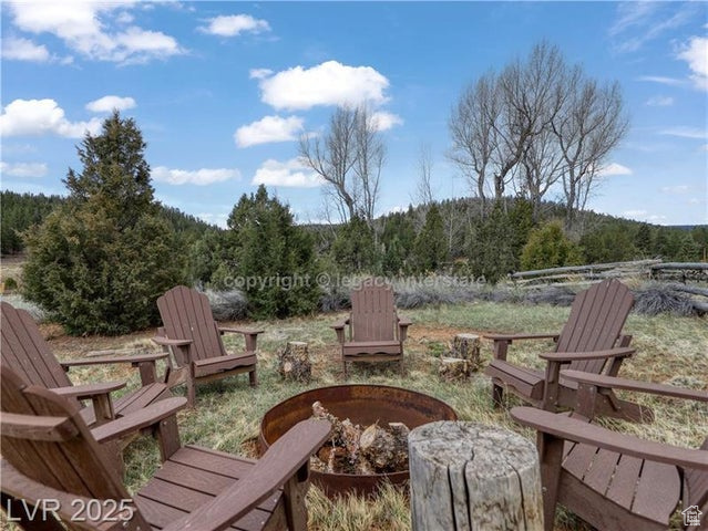View of patio featuring a wooded view